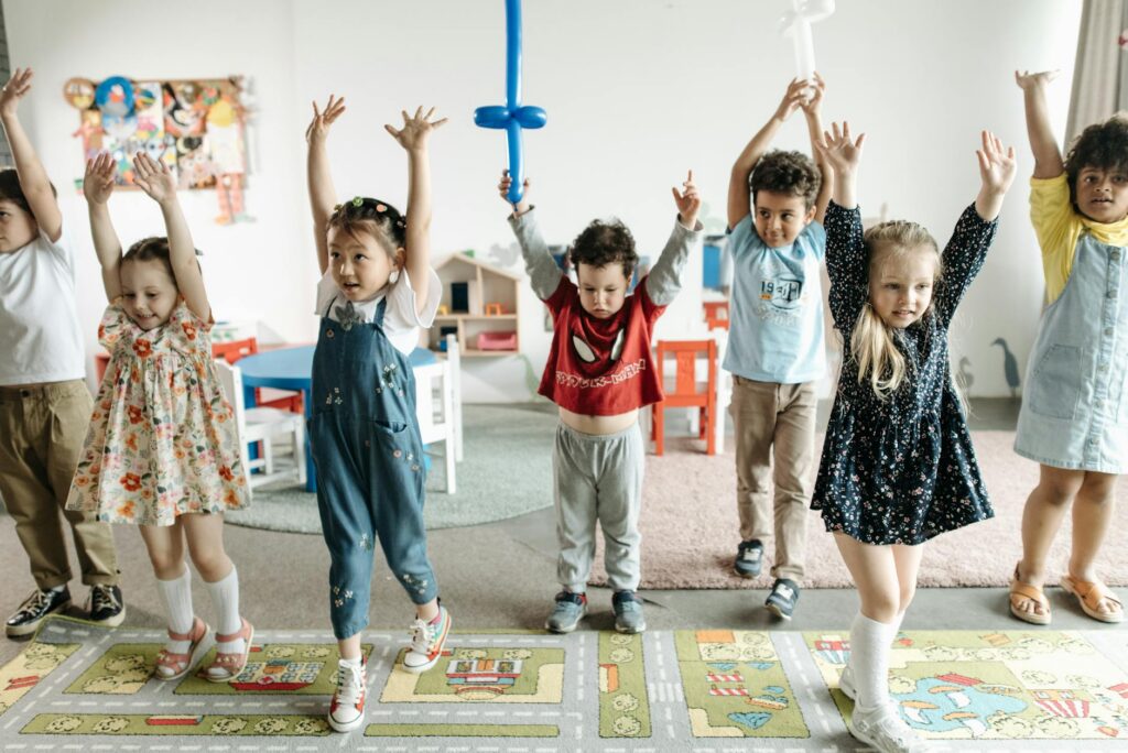 children raising their hands
